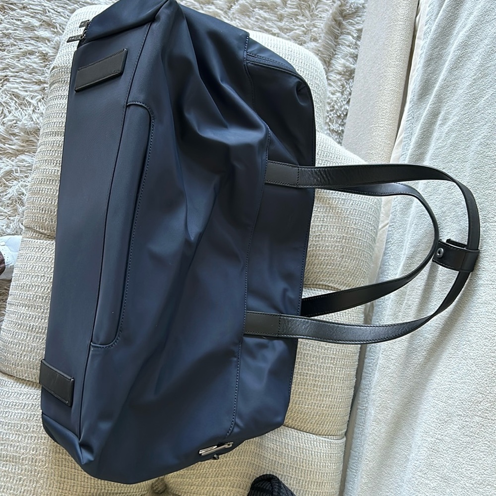 Brand new away weekender bag. Never been used. ￼